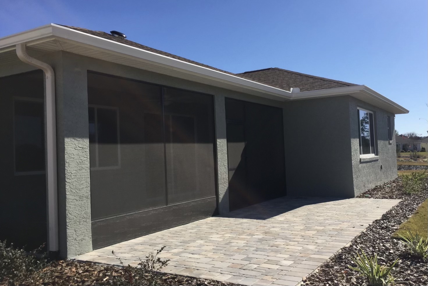 Lanai exterior with seamless gutter and downspout