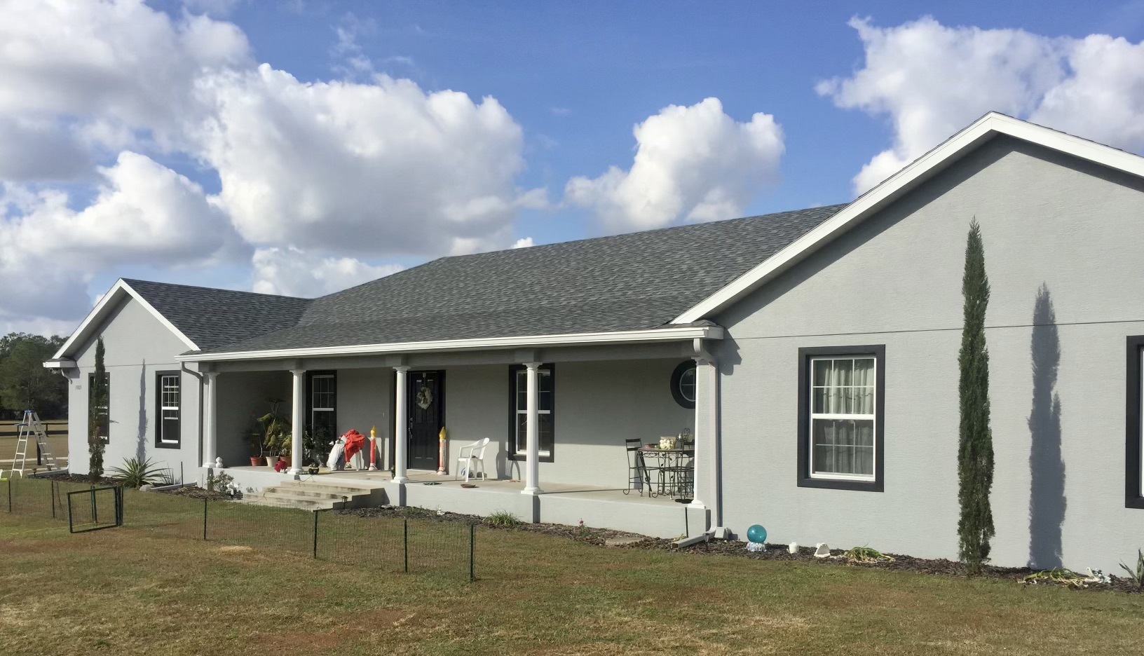 Ranch-style home with white seamless gutters in Central Florida