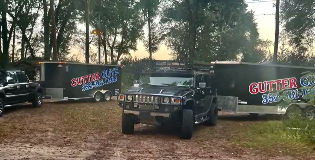 Gutter Guyz LLC trucks and trailers ready for a job in Ocala, FL