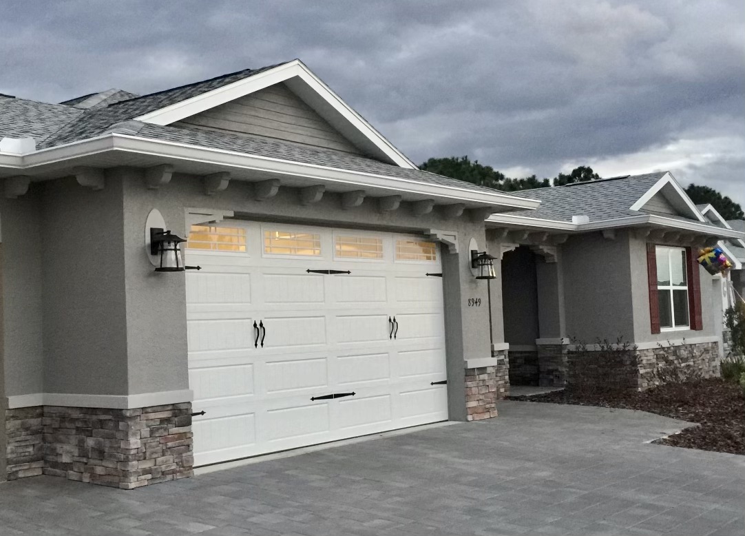 Craftsman-style home with white seamless gutters and downspouts